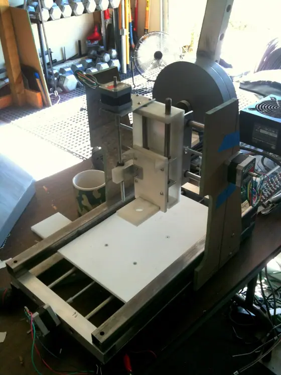 A home-built desktop CNC machine on a bench