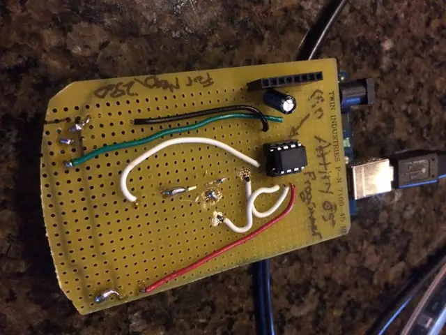 A hand-soldered microcontroller board on perfboard